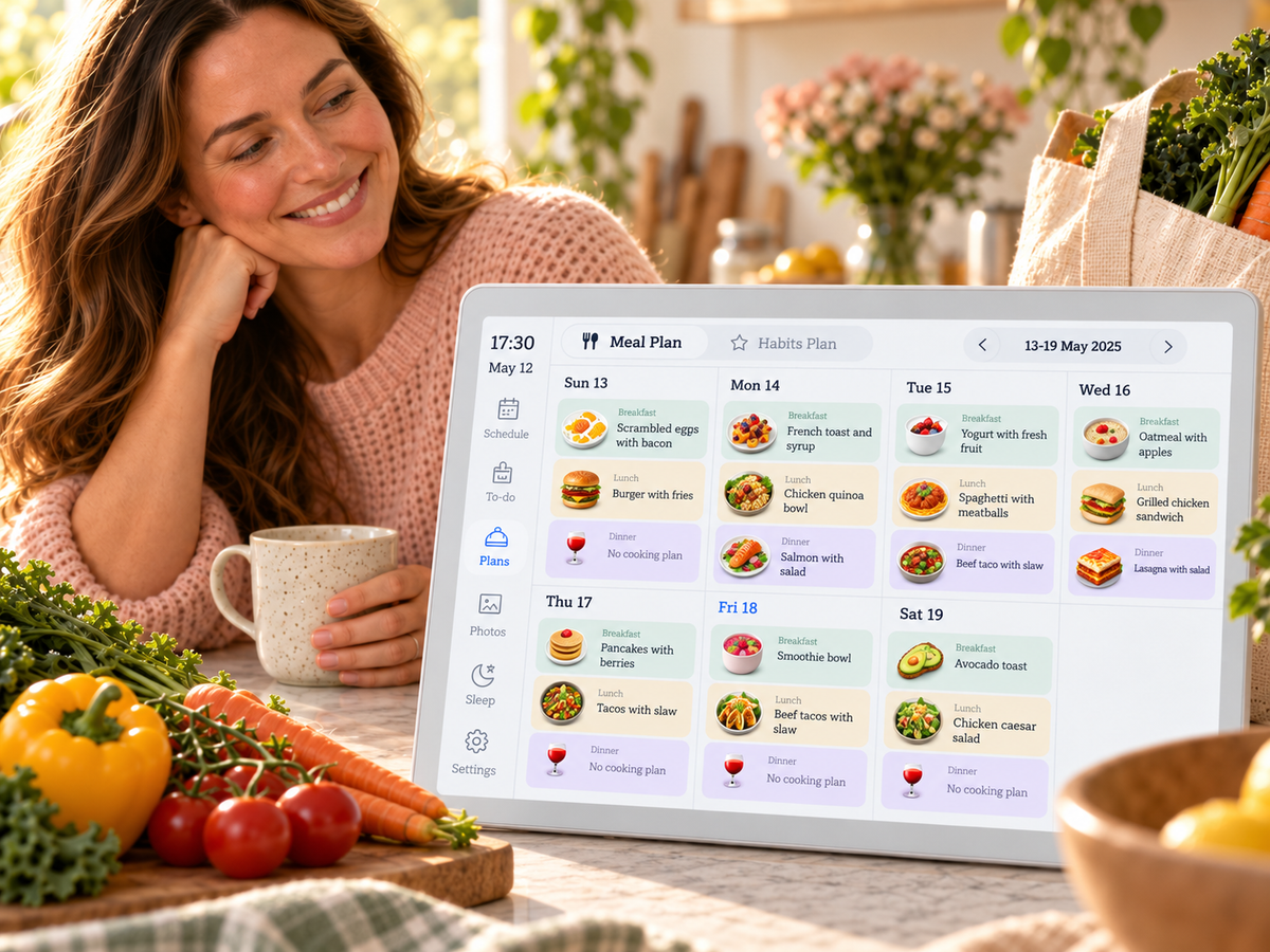 Mom relaxing with tea while PlanPal shows the week's meal plan, groceries on the counter
